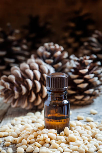 istock Essential oil of cedar in a small brown bottle 511207614