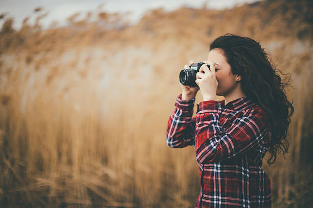 istock young woman taking pictures 511207768