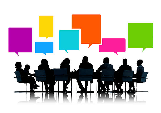 istock Silhouettes of Business People in a Meeting with Speech Bubbles 511207787