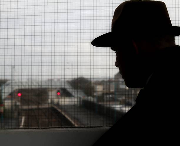 istock silhouette of man in fedora hat 511208718