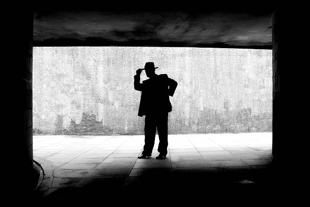 silhouette of gangster like figure