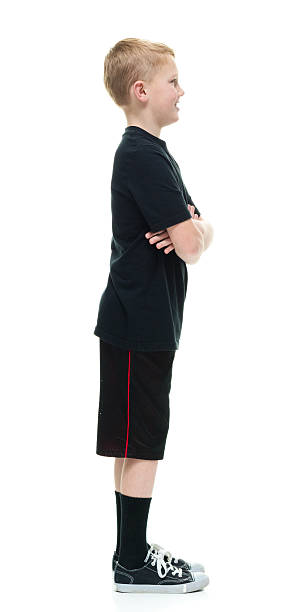 istock Smiling little boy standing with arms crossed 511208928