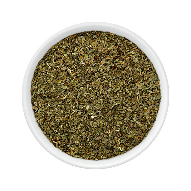 istock Dried Basil Flakes in a Ceramic Bowl 511209688