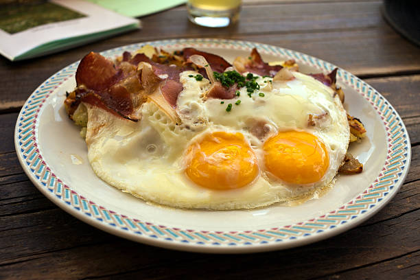 istock Traditional tyrolean dish made with potatoes, speck and fried eggs 511209808