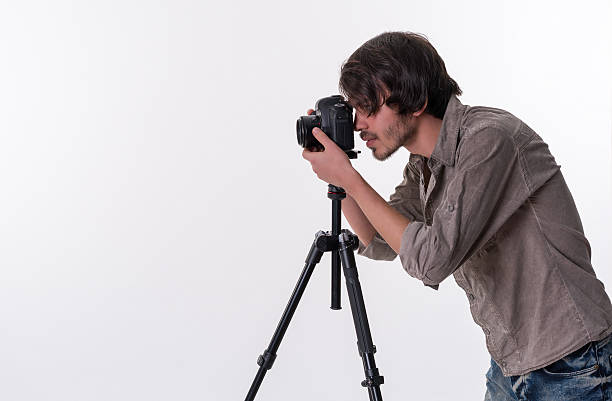 istock Photographer with camera and tripod 511211442