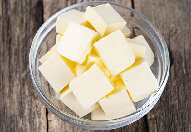 istock fresh butter in a glass bowl on wooden surface 511211774