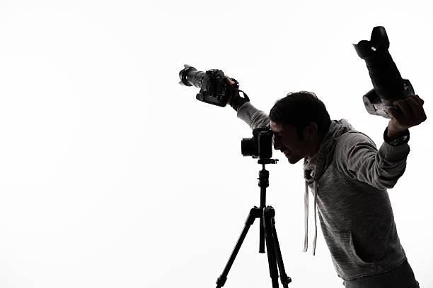 istock Photographer with camera and tripod 511211998