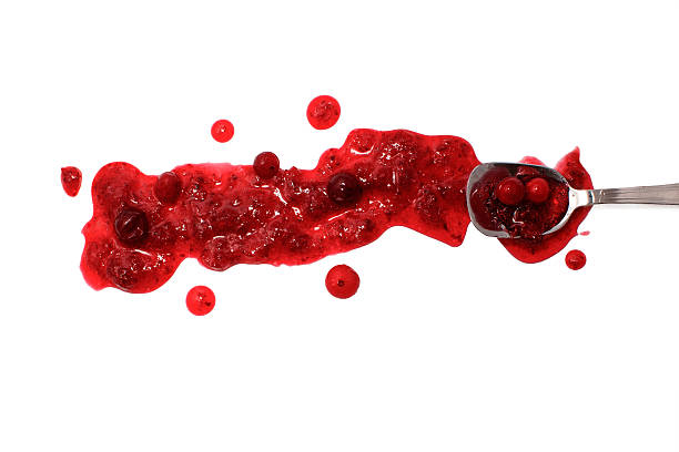 istock splashes and spilled cranberry sauce with a spoon 511214056