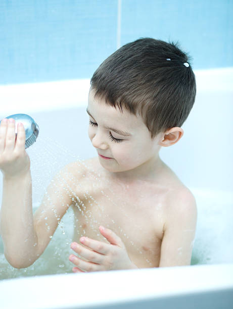 istock Child bathes in a bathroom 511214372