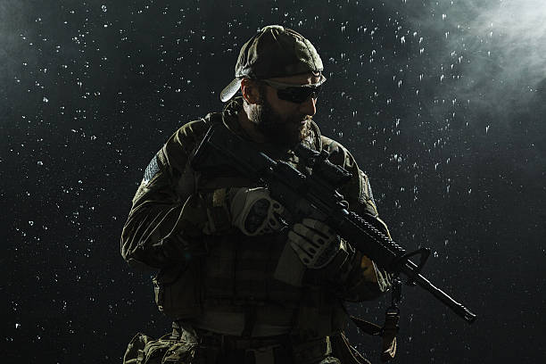 US Army soldier in the rain Green Berets US Army Special Forces Group soldier in the rain snakes beard stock pictures, royalty-free photos & images