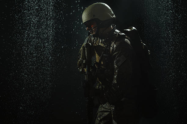 US Army soldier in the rain Green Berets US Army Special Forces Group soldier in the rain snakes beard stock pictures, royalty-free photos & images