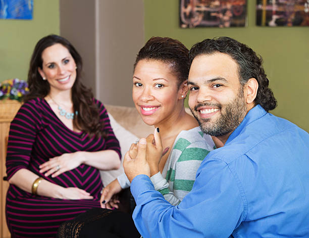 Hispanic Couple with Surrogate Mother stock photo