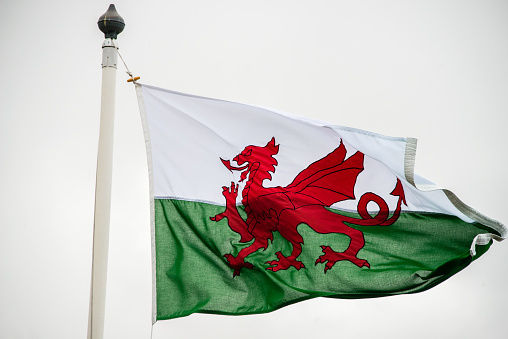 The Welsh flag against a cloudy sky