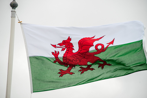 The Welsh flag against a cloudy sky