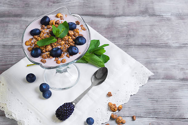 istock glass vase decorated with berries and granola yogurt 511217086
