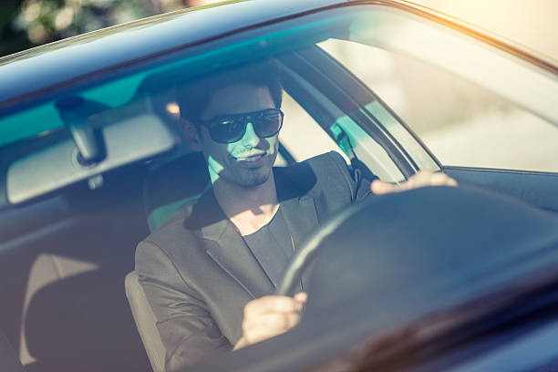 istock Handsome Young Businessman in the Drivers Seat how Smiling 511220412