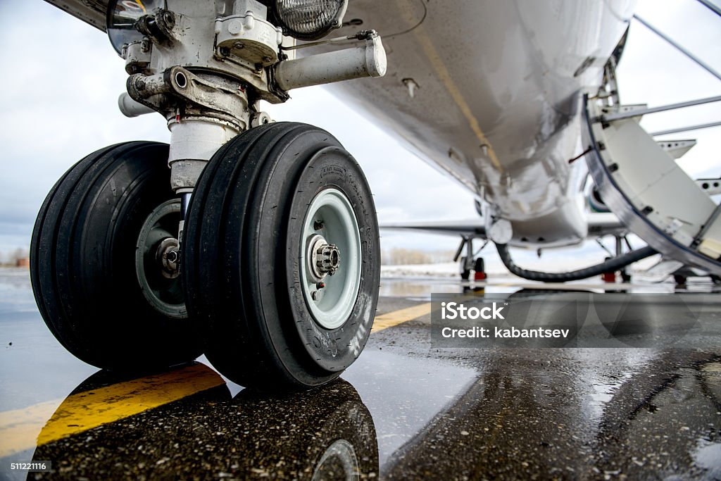 Embraer ERJ 145 aircraft landing gear on the runway Air Vehicle Stock Photo