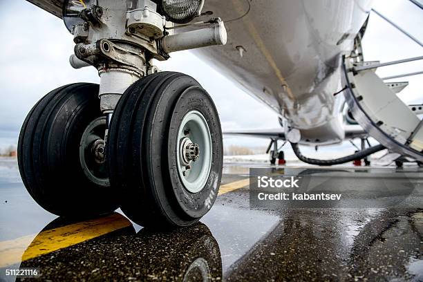 Embraer Erj 145 Aircraft Landing Gear On The Runway Stock Photo - Download Image Now
