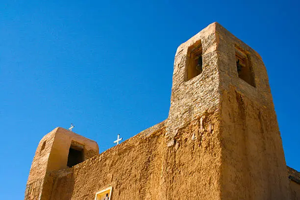 A National Trust Historic Site,  San Esteban Del Rey Mission was built in the 17th century from adobe, straw, mud and ponderosa pine using slave labor. Acoma Pueblo (Sky City) is a Native American pueblo dating back to the 13th century. Copy space in the sky.