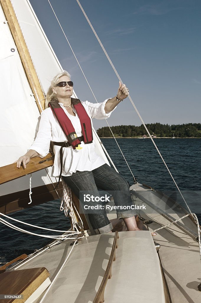 Happy Mature Woman Sailing on Mahone Bay, Nova Scotia Active Lifestyle Stock Photo