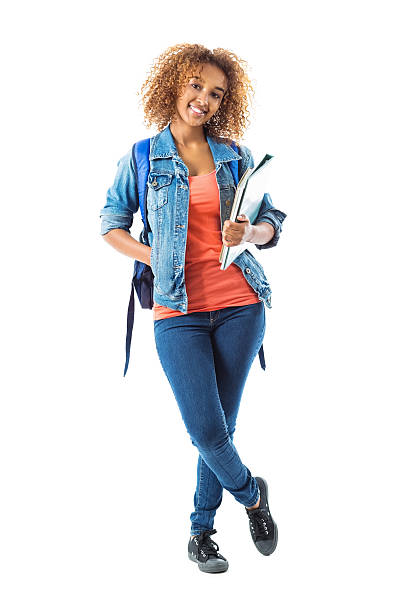 Cute teenage girl wearing backpack and holding school books Cute teenage girl wearing backpack and holding school books double denim stock pictures, royalty-free photos & images