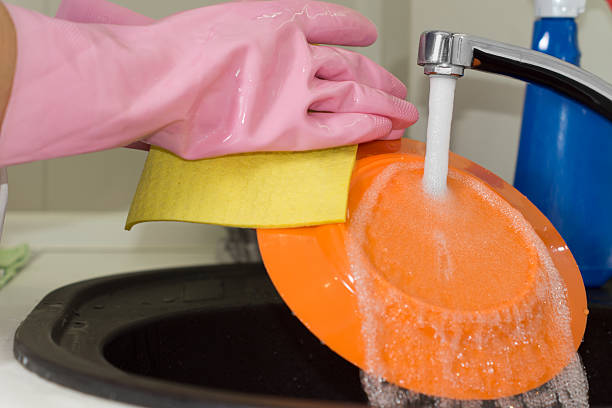 istock Person washing dishes in the kitchen 511244695