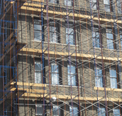 Close-up of Manhattan building encased in scaffolding