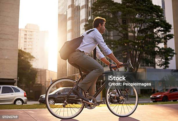 Off To Work In The Crisp Morning Air Stock Photo - Download Image Now - Cycling, Bicycle, City