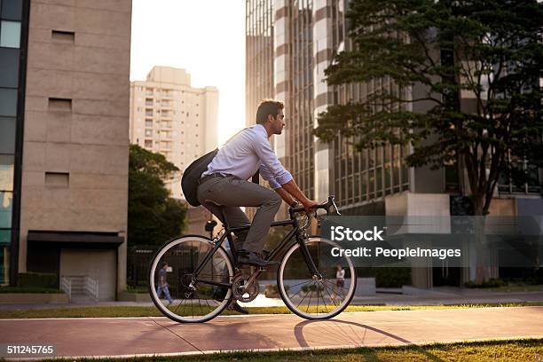 Getting A Moving Start On The Day Stock Photo - Download Image Now - Cycling, Bicycle, City