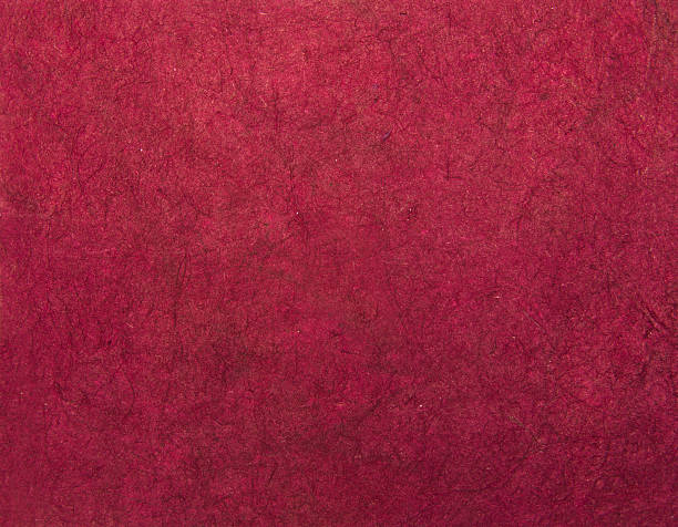 istock Magenta handmade asian paper texture with scratches 511246755