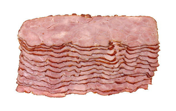 Slices of turkey bacon Top view of several slices of turkey bacon on a white background. Turkey Bacon stock pictures, royalty-free photos & images
