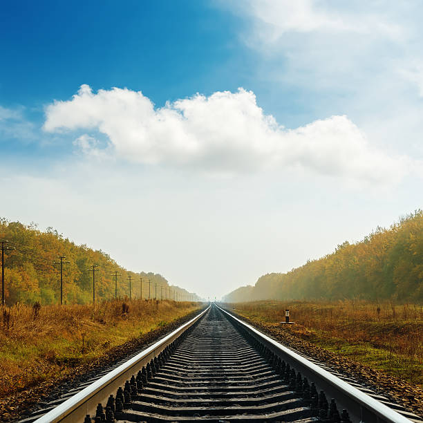 istock railroad to horizon in autumn 511281115