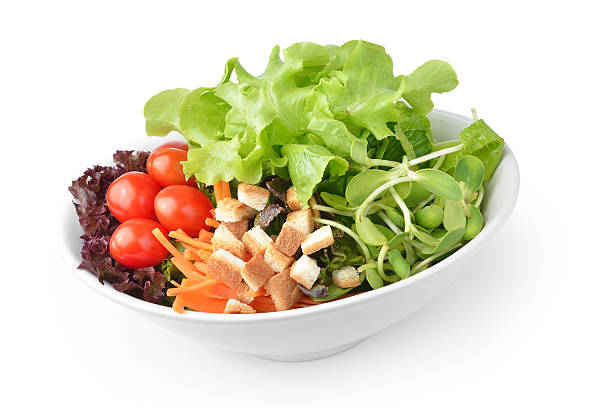istock salad in plate isolated on white background 511283471