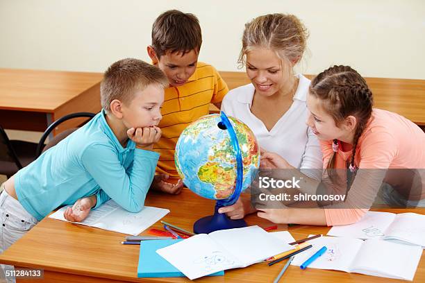 Geography Lesson Stock Photo - Download Image Now - Adult, Boys, Cheerful