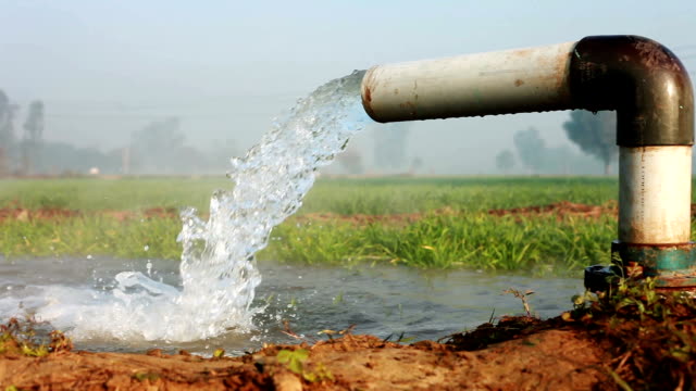 Irrigation pipe with flowing water