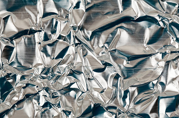 istock Crumpled Aluminum Foil Background 511296628