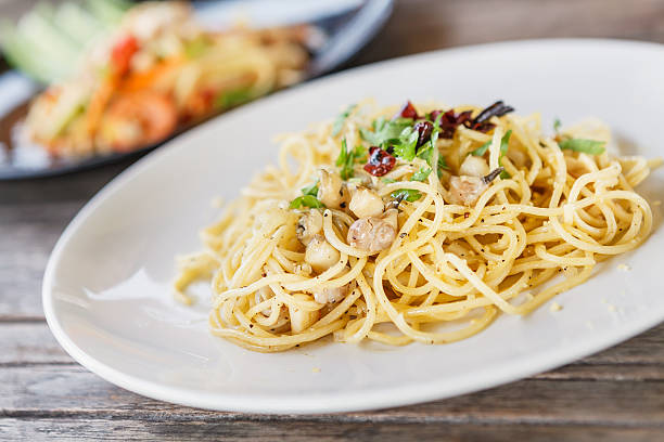 istock Spicy spaghetti with Spotted babylon. thai food 511299712