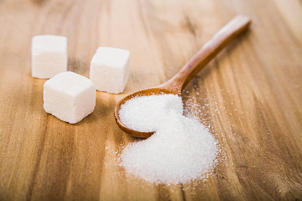 istock Sugar in a wooden spoon 511299978