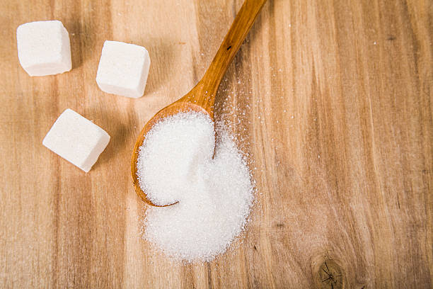 istock Sugar in a wooden spoon 511300006