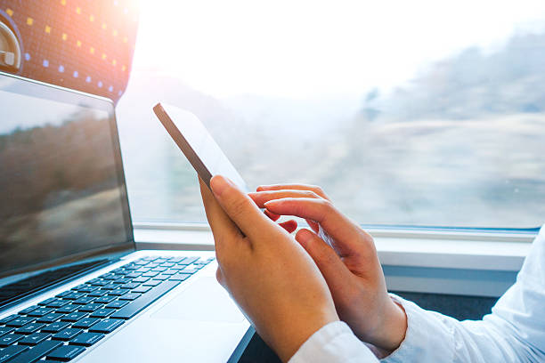 istock Reading Smart Phone in Hand, Traveling by Train 511301132