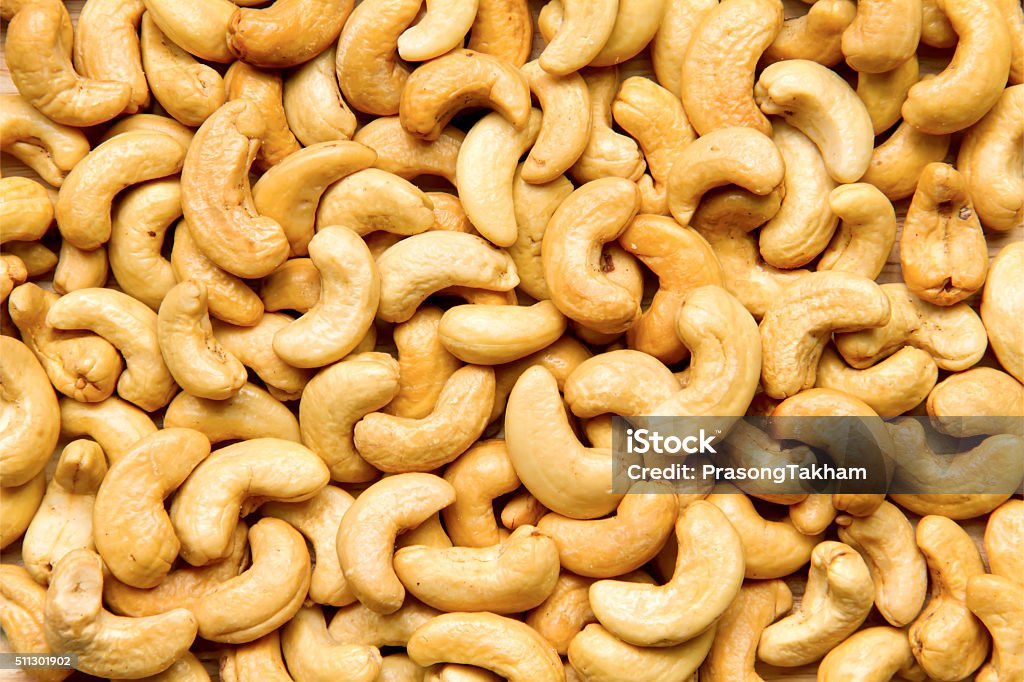 Healthy food, cashews rich in heart friendly fatty acids. Cashew Healthy food, cashews rich in heart friendly fatty acids. Cashew nuts as food background Cashew Stock Photo