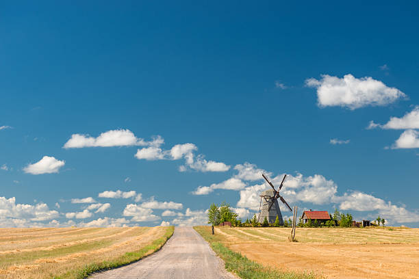 istock Retro windmill in a field, rural landscape 511302950