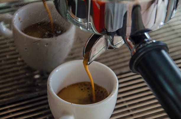 istock Barista making a cup of coffee soft focus image . 511303814
