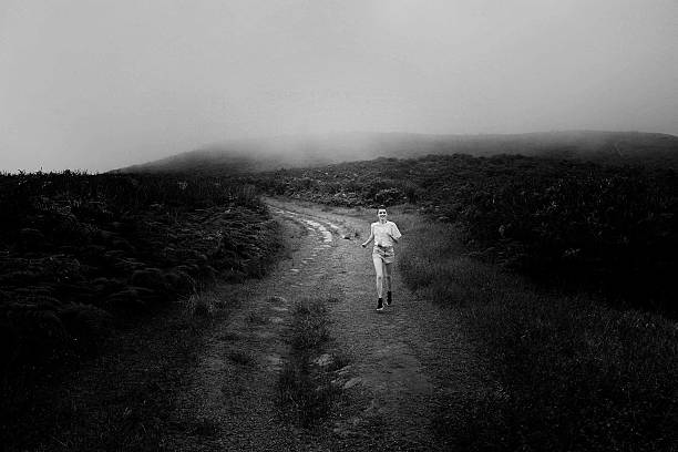 istock girl is running on the path in jungle 511304208