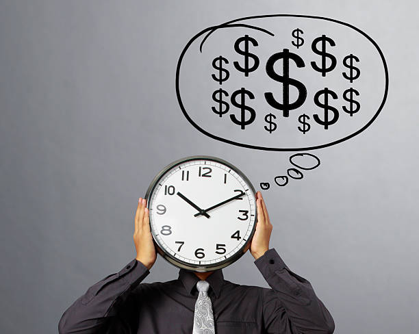 istock Businessman is holding clock  of head 511304886