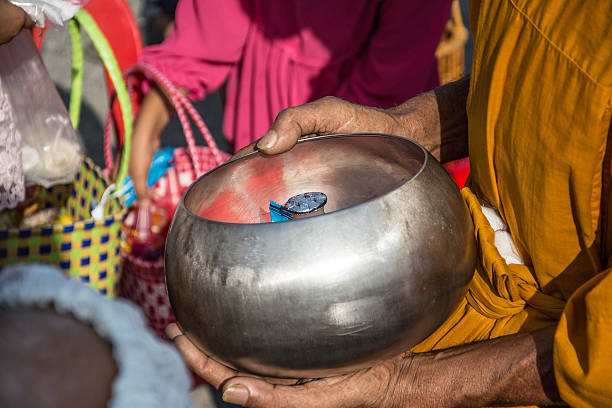 istock Buddhist monks are given food offering from people 511305680