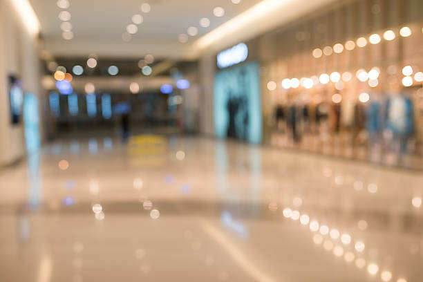 istock Shopping mall blur background with holiday lights 511306670