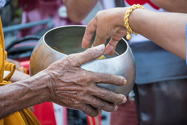 istock Buddhist monks are given food offering from people 511306938