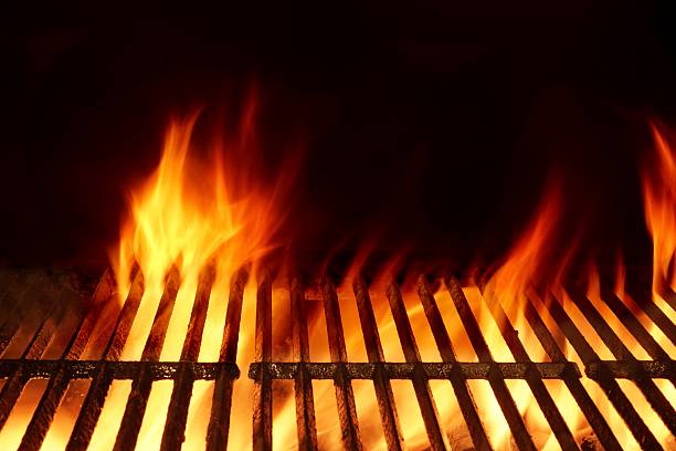 istock Empty Flaming Barbecue Grill Isolated On Black Background. Top V 511307368