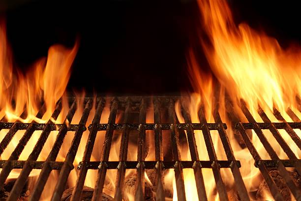 istock Empty Flaming Barbecue Grill Isolated On Black Background. Top V 511307426